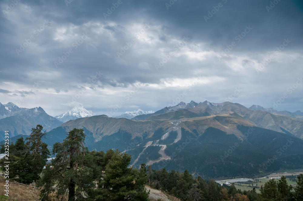 Dark mountain landscape. Caucasian mountains in cloudy weather.