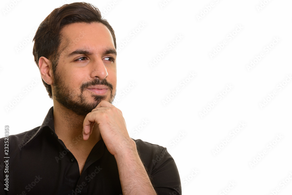 Young handsome Indian man thinking and planning