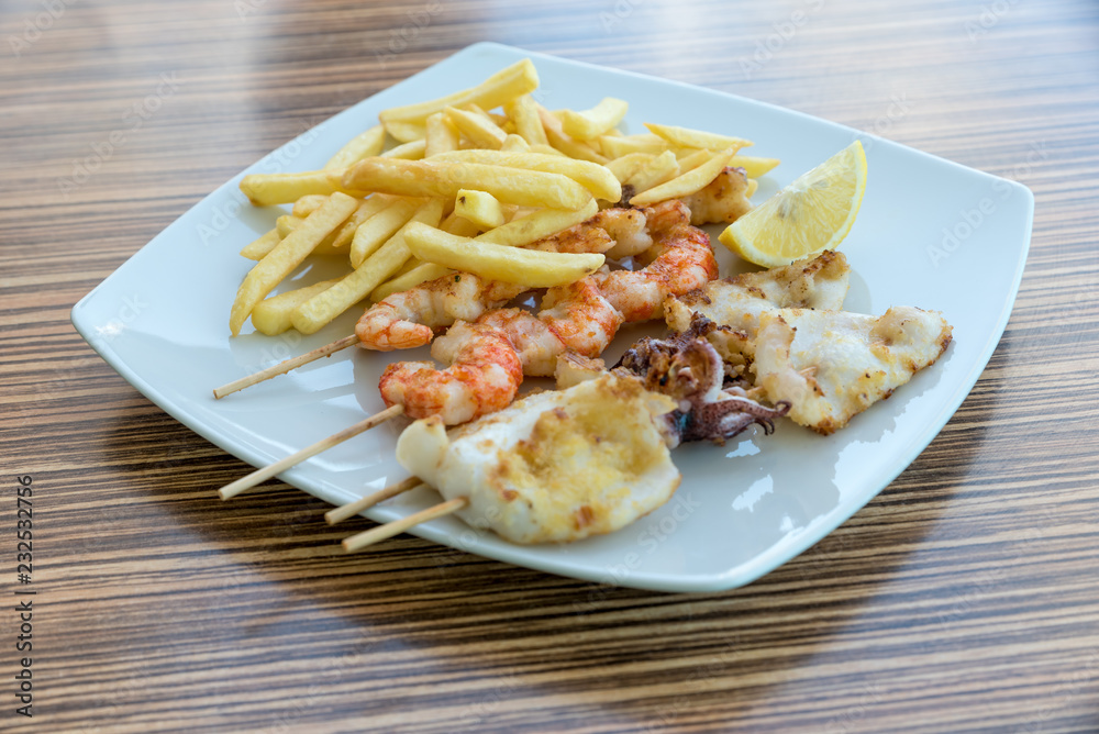 Fish skewers with fries Fish skewers with fries