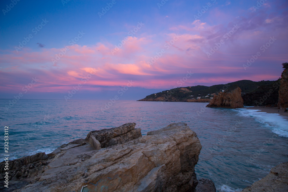 beach with rocks and sky