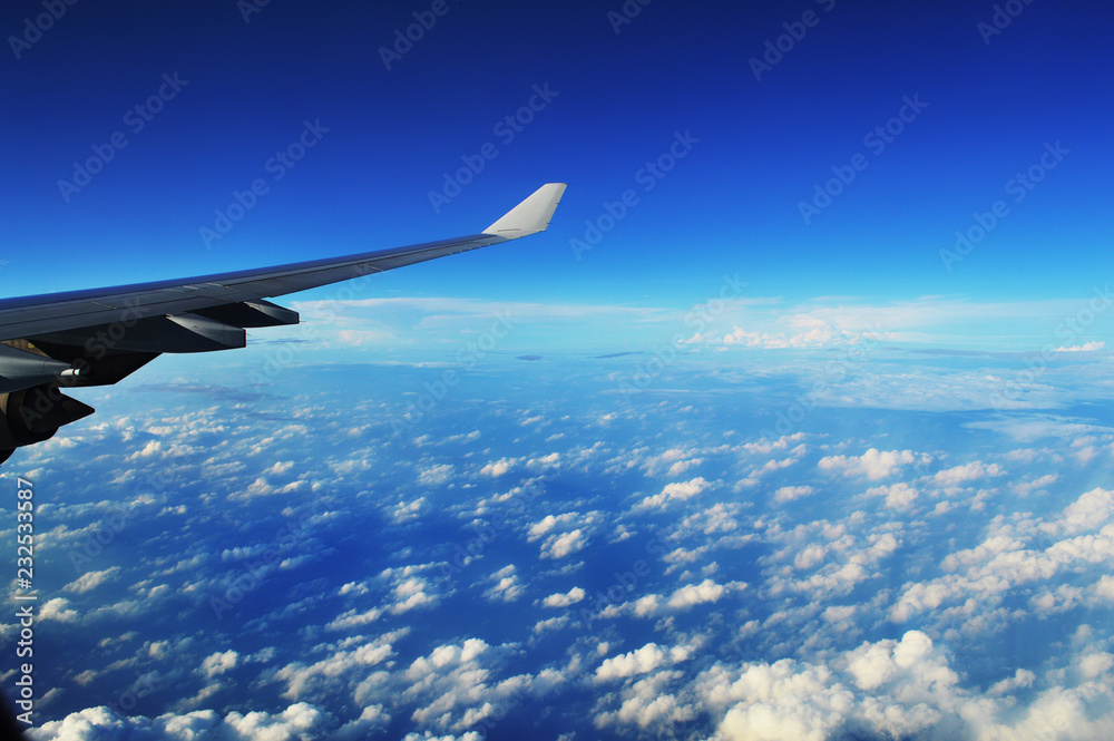 the wing of the plane in the clouds the wing of the plane in the clouds