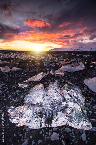 Beautiful sunset over famous Diamond beach, Iceland. photo