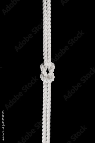 White ship ropes connected by reef knot isolated