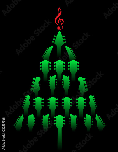 A Christmas tree made of guitar headstocks with a g-clef on top. 