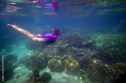 Woman swimming in water, Beautiful woman under water before dive to coral reef, woman snorkeling in blue mask, snorkel woman face in mask, tropical sea snorkeling, summer vacation activity