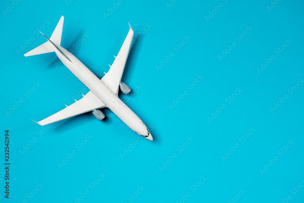 Photo of plane on empty blue background