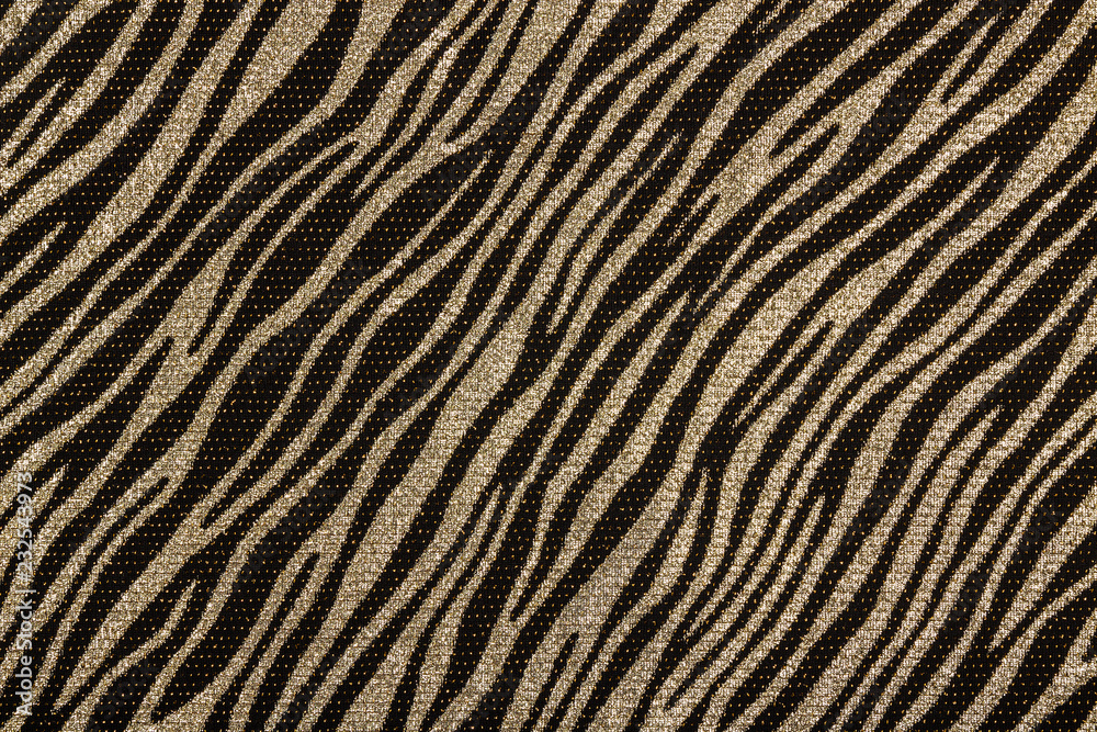 Fototapeta Black fabric with golden zebra pattern