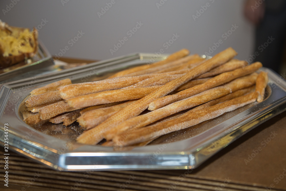 Long Crispy Breadsticks inside a Silver Tray