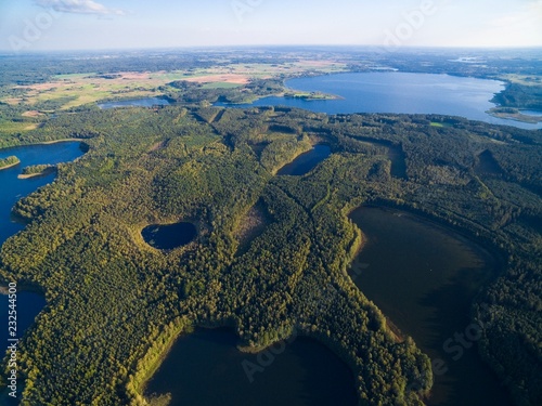 Aerial view of beautiful landscape of Mazury region - Krzywa Kuta Lake, Goldopiwo Lake in the distance, Poland