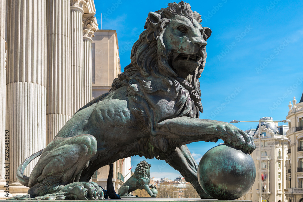 Lion statue at the entrance of the Spanish Parliament, Madrid, Spain