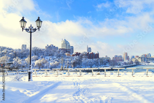 Winter  city landscape, covered with snow with a beautiful lantern.  View of the buildings,  skyscrapers  and towers,  Ukraine,  Dnepropetrovsk,  Dnipro