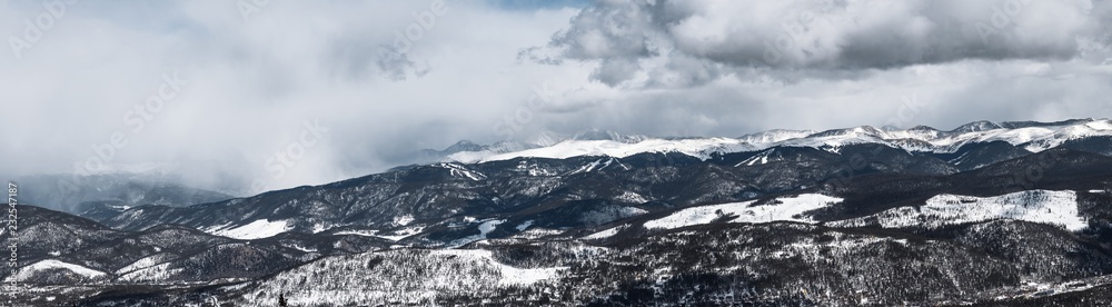 Mist rises as dramatic snowstorm moves across mountain valley Mist rises as dramatic snowstorm moves across mountain valley