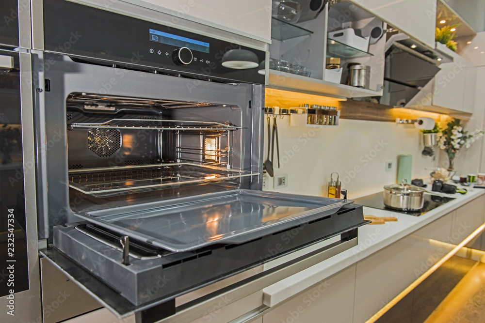Modern kitchen cooker oven in a luxury apartment Modern kitchen cooker oven in a luxury apartment