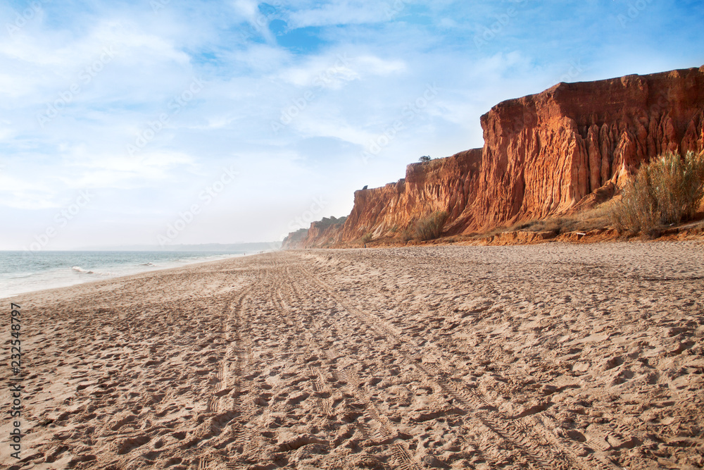 Falesia beach in Albufeira, Algarve region, Portugal. Wide sandy beach with amazing rocks Falesia beach in Albufeira, Algarve region, Portugal. Wide sandy beach with amazing rocks