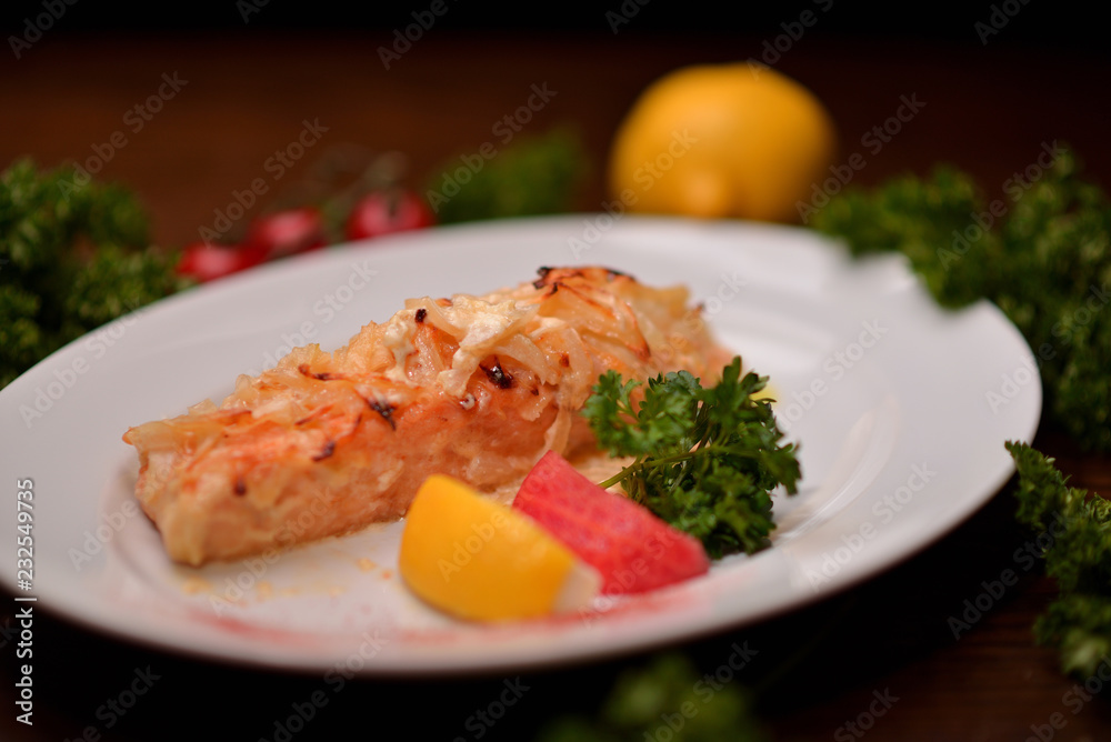 baked salmon with vegetables on white plate baked salmon with vegetables on white plate