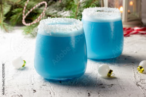 Blue curacao Christmas Cocktail on Christmas decorated holiday table