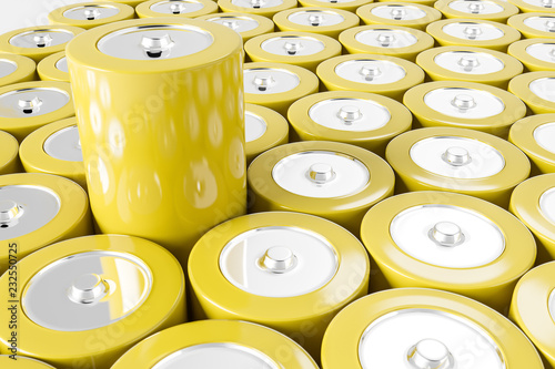 Rows of yellow alkaline batteries, one sticking