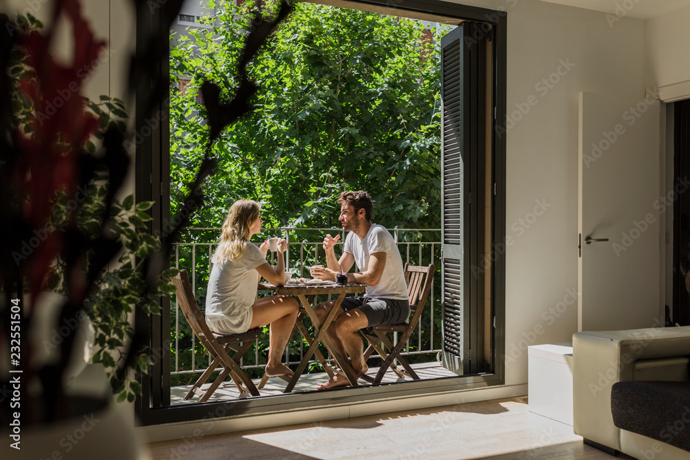 Adorable couple enjoying breakfast in summer Adorable couple enjoying breakfast in summer