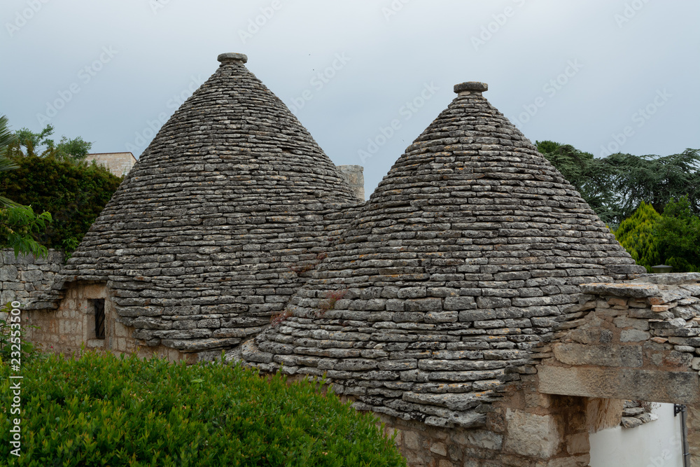 Unique small South Italia city Alberobello with antient stones conical houses trullo, tourist destination Unique small South Italia city Alberobello with antient stones conical houses trullo, tourist destination