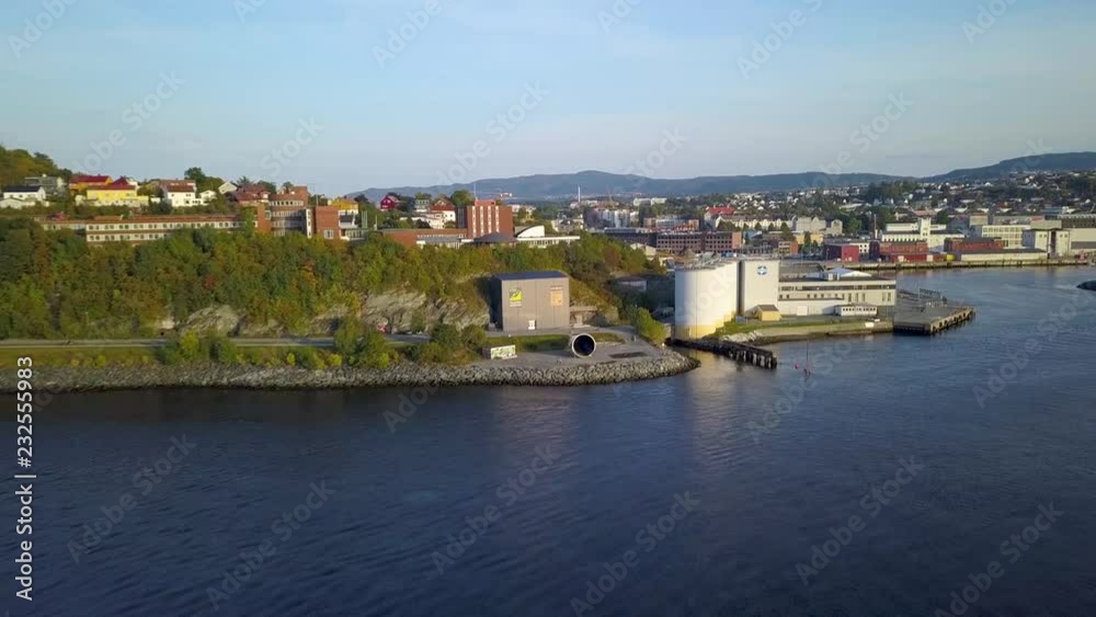 Aerial Capture of Trondheim City, Norway - Sunny Summer Day, Starting Movement From the Fjord to City, over Water - Sunset Colours Aerial Capture of Trondheim City, Norway - Sunny Summer Day, Starting Movement From the Fjord to City, over Water - Sunset Colours