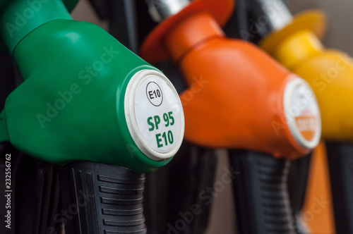 closeup of gas pistols in gas Station photo