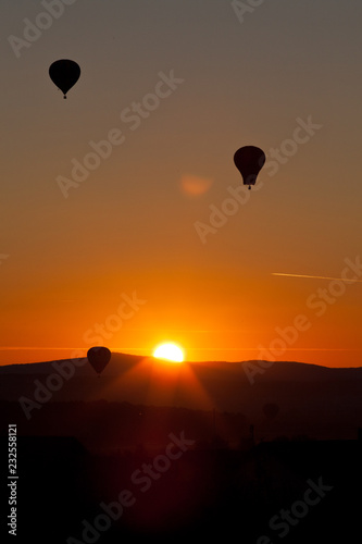 hot air balloons at sunset - freedom and adventure concept