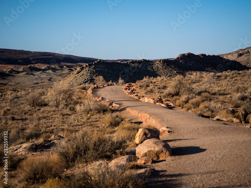 Gravel hiking trail through the dry and arid desert of Utah in Arches National Park. photo