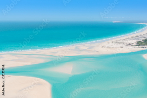Aerial view of turquoise tidal flats waters photo