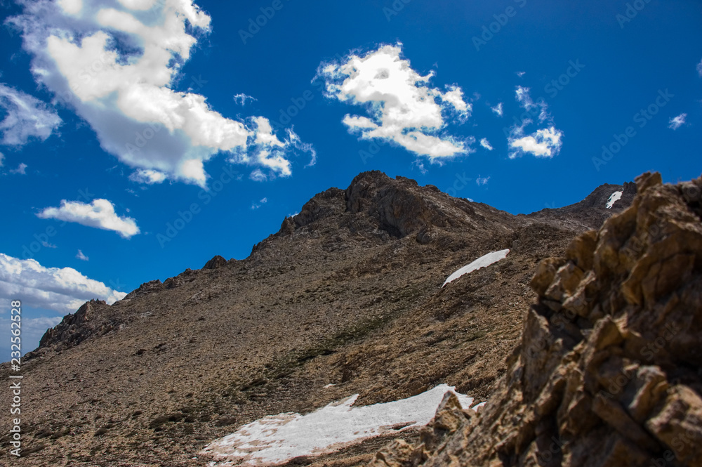 Landscape of snowy mountains and peak with blue sky and clouds. Landscape of snowy mountains and peak with blue sky and clouds.