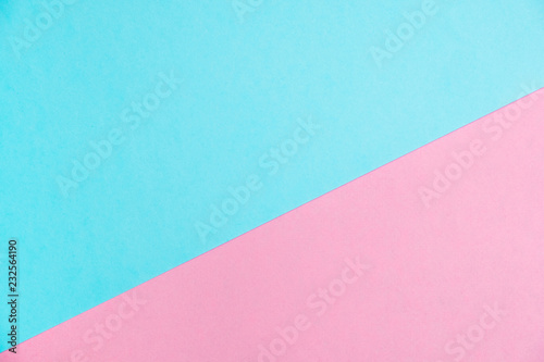 Pastel colored paper flat lay top view, background texture, pink and blue.