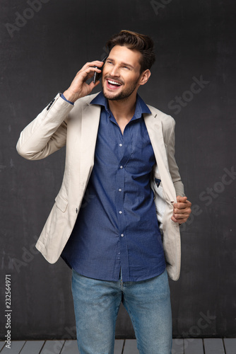 Happy handsome man over with phone