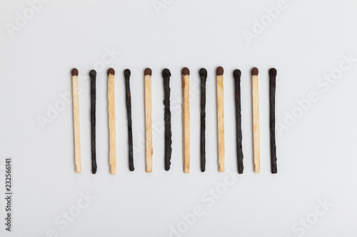 Matches forming sequence on slightly gray background photo