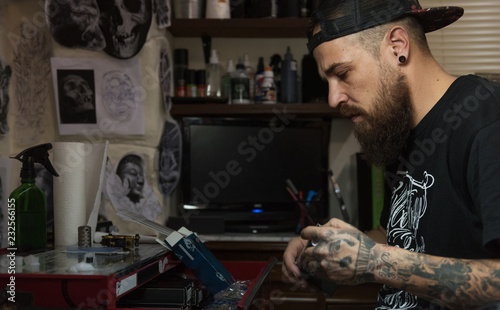 Master preparing for making tattoo