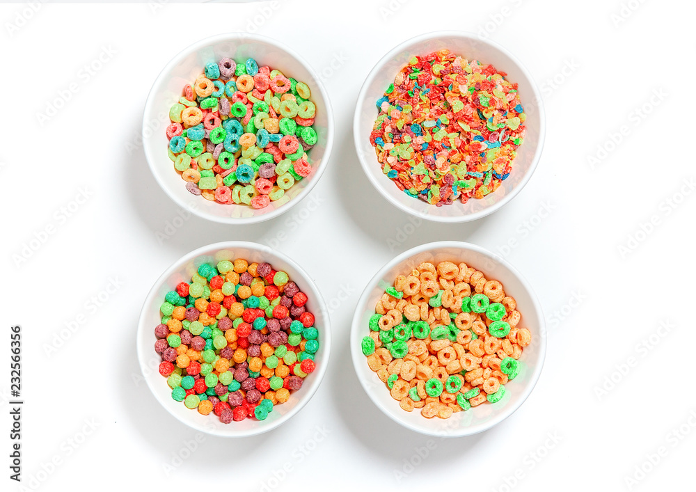 bowls of different colorful cereal on a white background. multicolored  rings, balls and breakfast cereals. flat lay, top view Stock Photo | Adobe  Stock