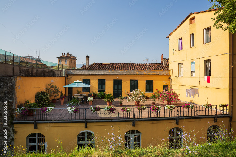 Rooftop garden terrace as seen from a walk around the walls encircling the beautiful city of Lucca in Tuscany, Italy