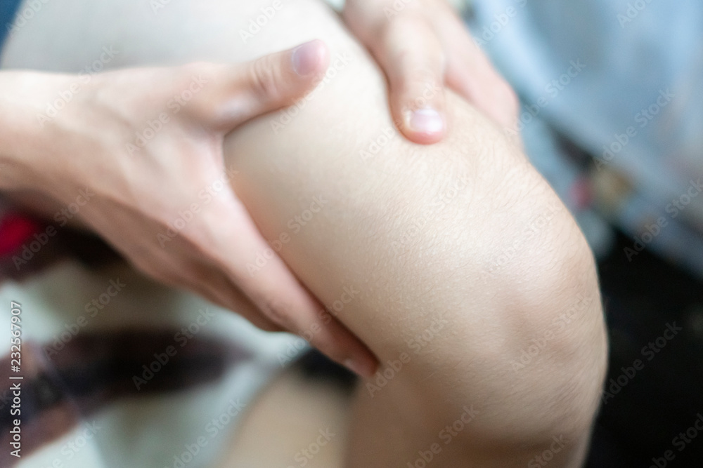close up person touch the knee feeling the bone pain, suffer from pain f