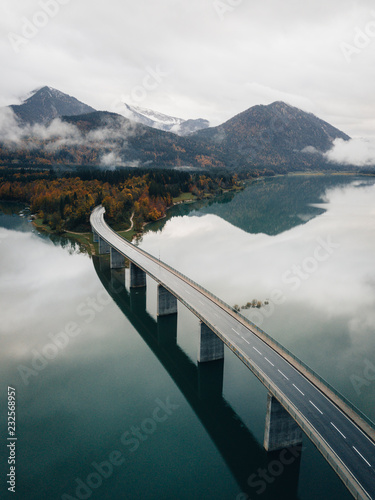 Lake bridge leading into mountains in Germany