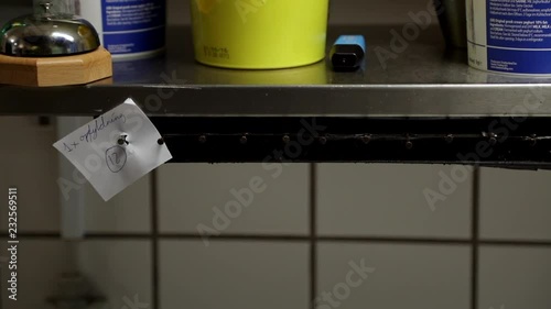 Ticket coming in to kitchen in restaurant