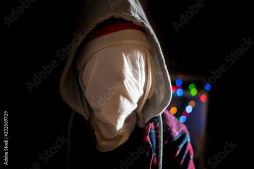 anonymous head face in the hood maniac in dark situation f © Mihail
