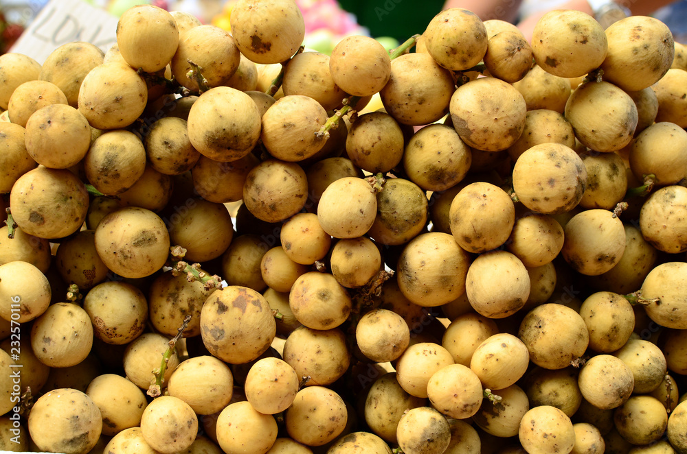 fresh lanzones fruit symmetrically to attrack buyers at market stall fresh lanzones fruit symmetrically to attrack buyers at market stall