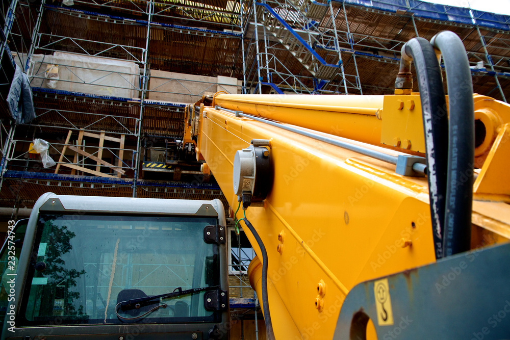 Yellow crane at construction site