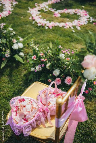 Pink flowers in an outdoors wedding photo