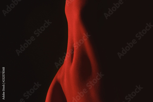stomach in red light in the dark photo