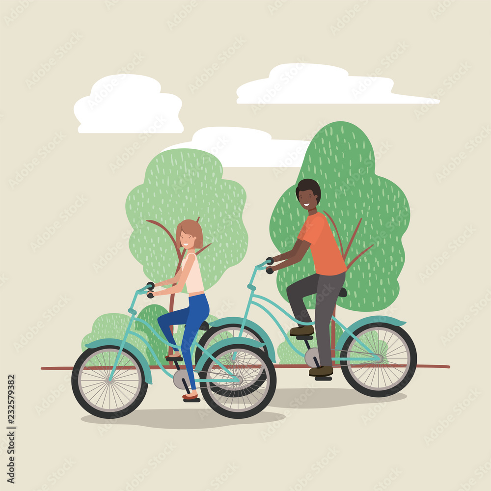 young couple on bicycle in the park young couple on bicycle in the park