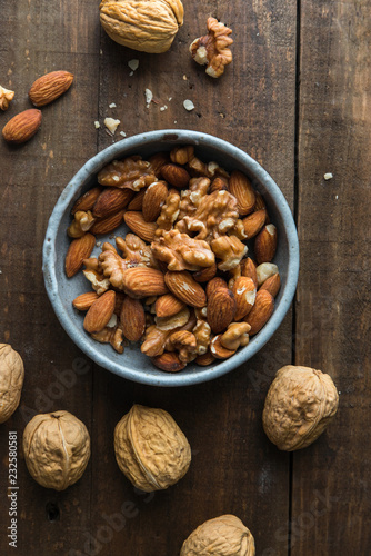Almond and walnut on wooden background