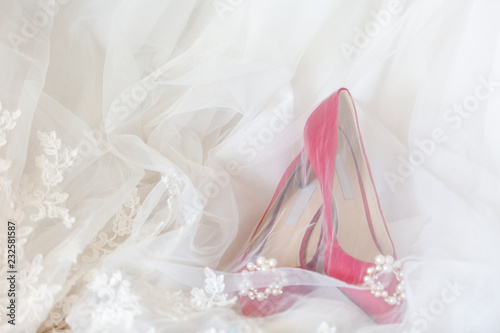 Red heels and a white wedding dress