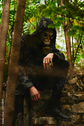 Man with gasmask on some ruins photo