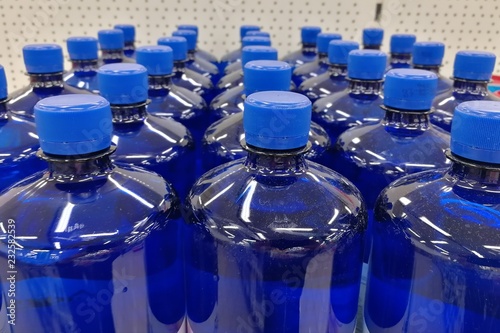 many blue plastic bottles
