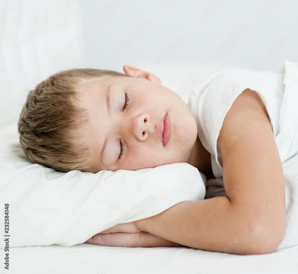 little boy is sleeping on his side little boy is sleeping on his side