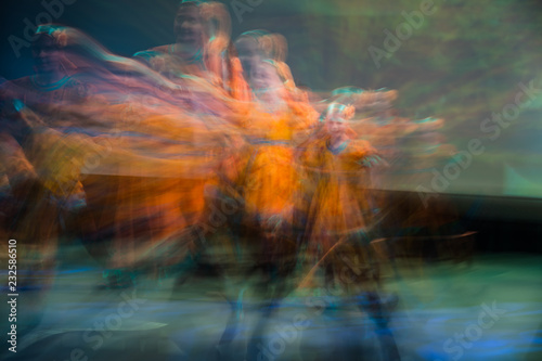 Beautiful movements in dance, shot on long exposure. Children ensemble. Moscow. Russia photo